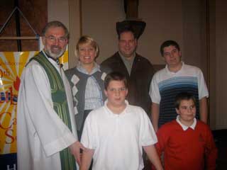 Steve Antush and Family with Fr. John